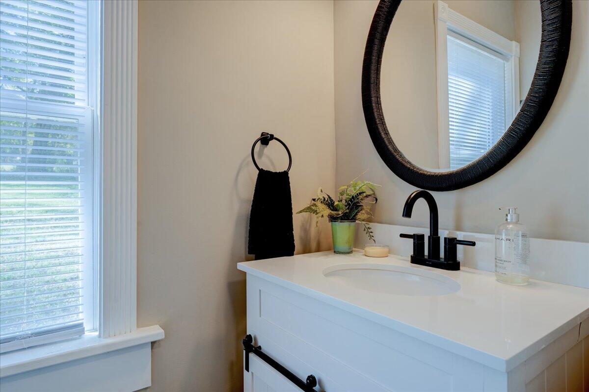 4534 Main Street Drakes Branch, VA 23937 - Photo 20 of 36 a bathroom with a sink and a mirror