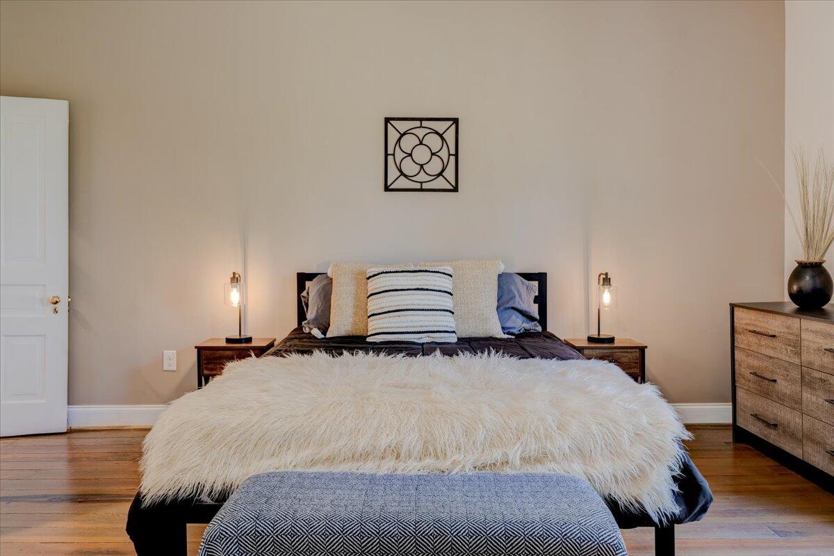 4534 Main Street Drakes Branch, VA 23937 - Photo 24 of 36 a bedroom with a bed and a lamp on desk