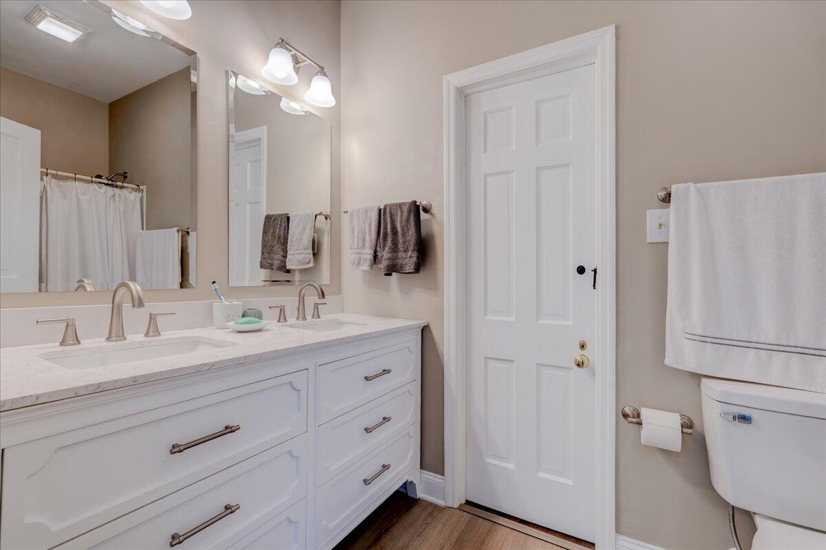 4534 Main Street Drakes Branch, VA 23937 - Photo 30 of 36 a bathroom with a double vanity sink toilet and shower