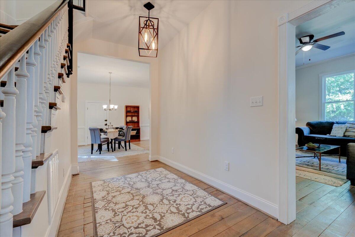 4534 Main Street Drakes Branch, VA 23937 - Photo 3 of 36 a view of a hallway with dining room and wooden floor
