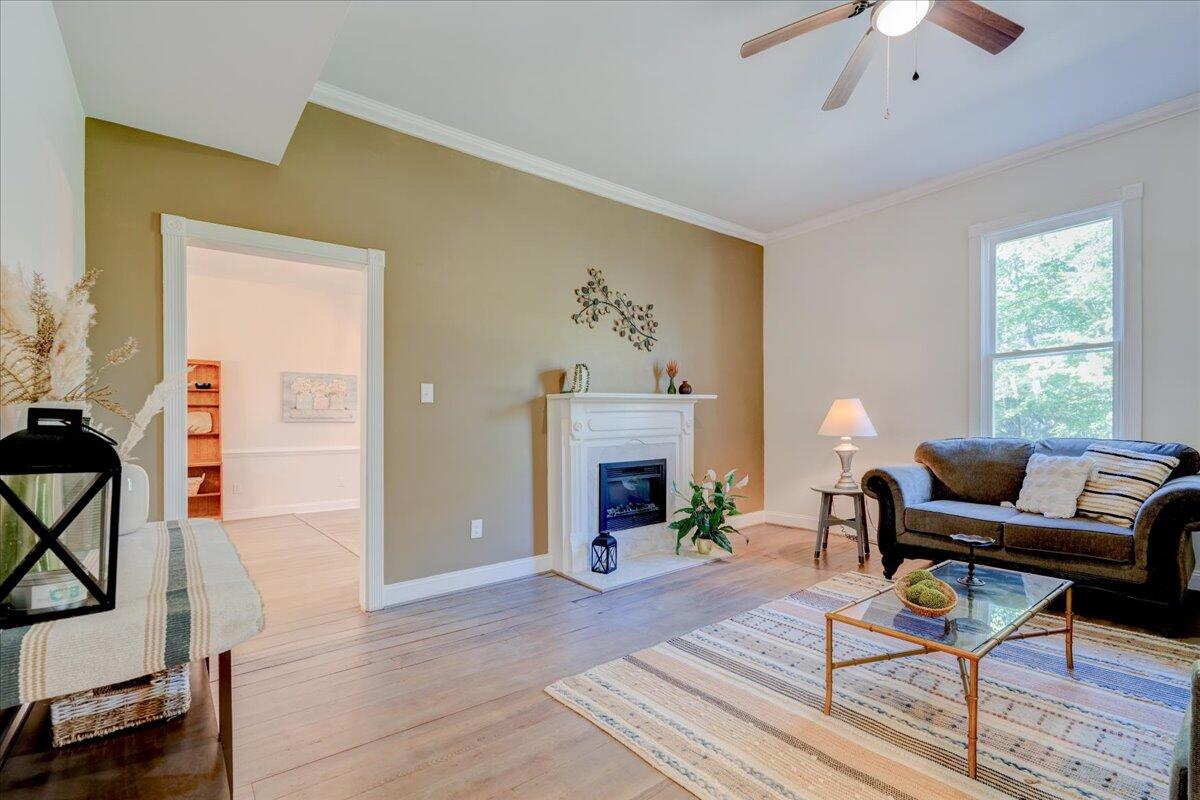 4534 Main Street Drakes Branch, VA 23937 - Photo 6 of 36 a living room with furniture and a fireplace