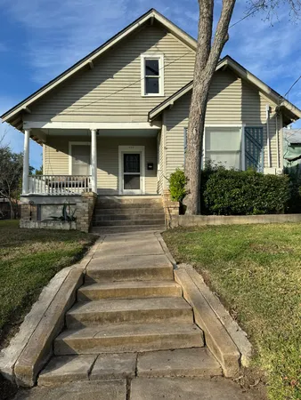 a front view of a house with yard