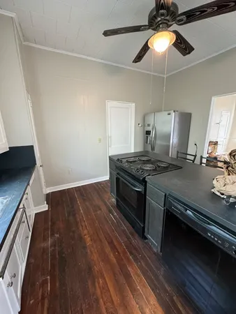 a kitchen that has a stove and a microwave