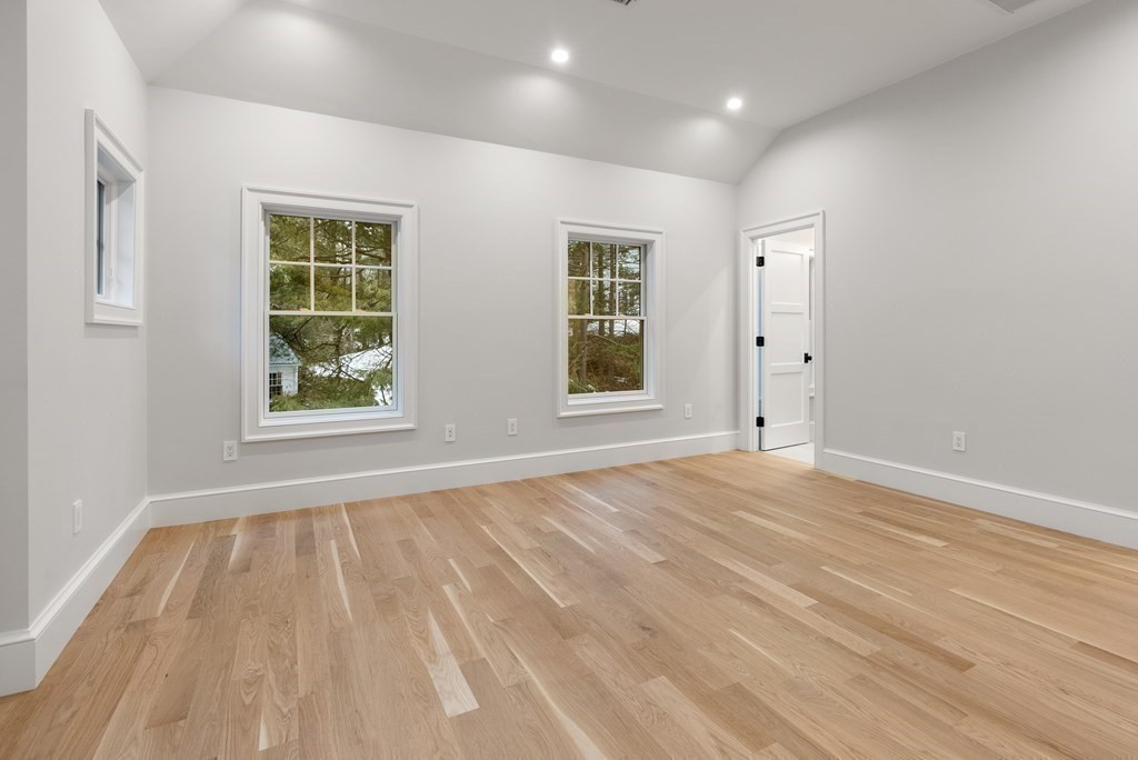 76 Bristol Road Wellesley, MA 02481 - Photo 19 of 36 a view of an empty room with wooden floor and a window