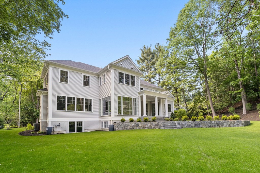 76 Bristol Road Wellesley, MA 02481 - Photo 33 of 36 a front view of a house with a garden and trees
