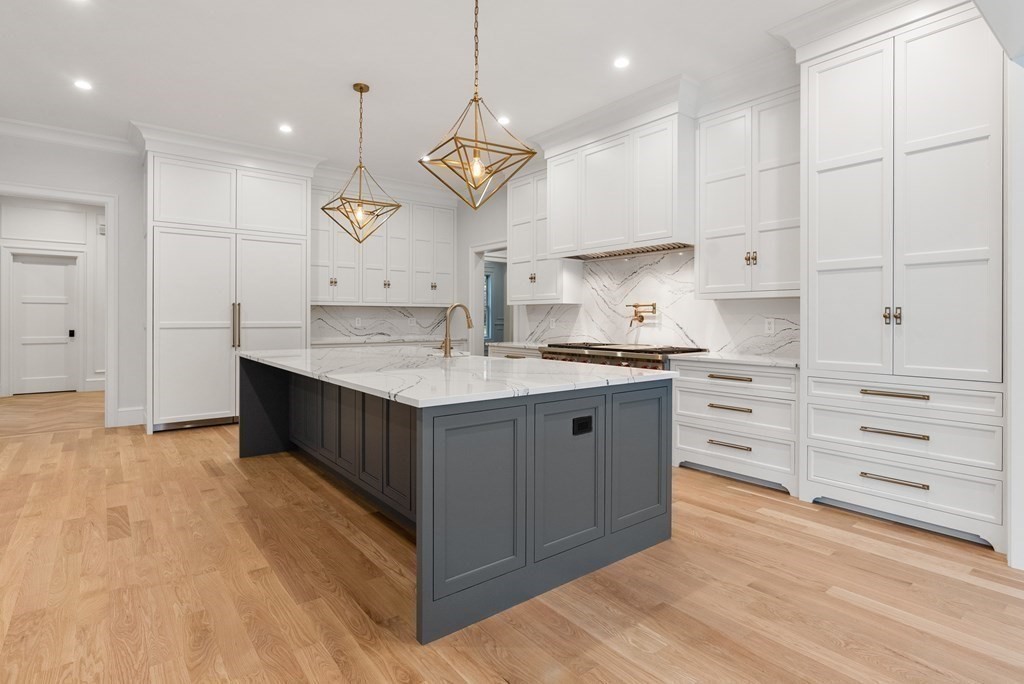 76 Bristol Road Wellesley, MA 02481 - Photo 6 of 36 a kitchen with kitchen island a sink stainless steel appliances and cabinets