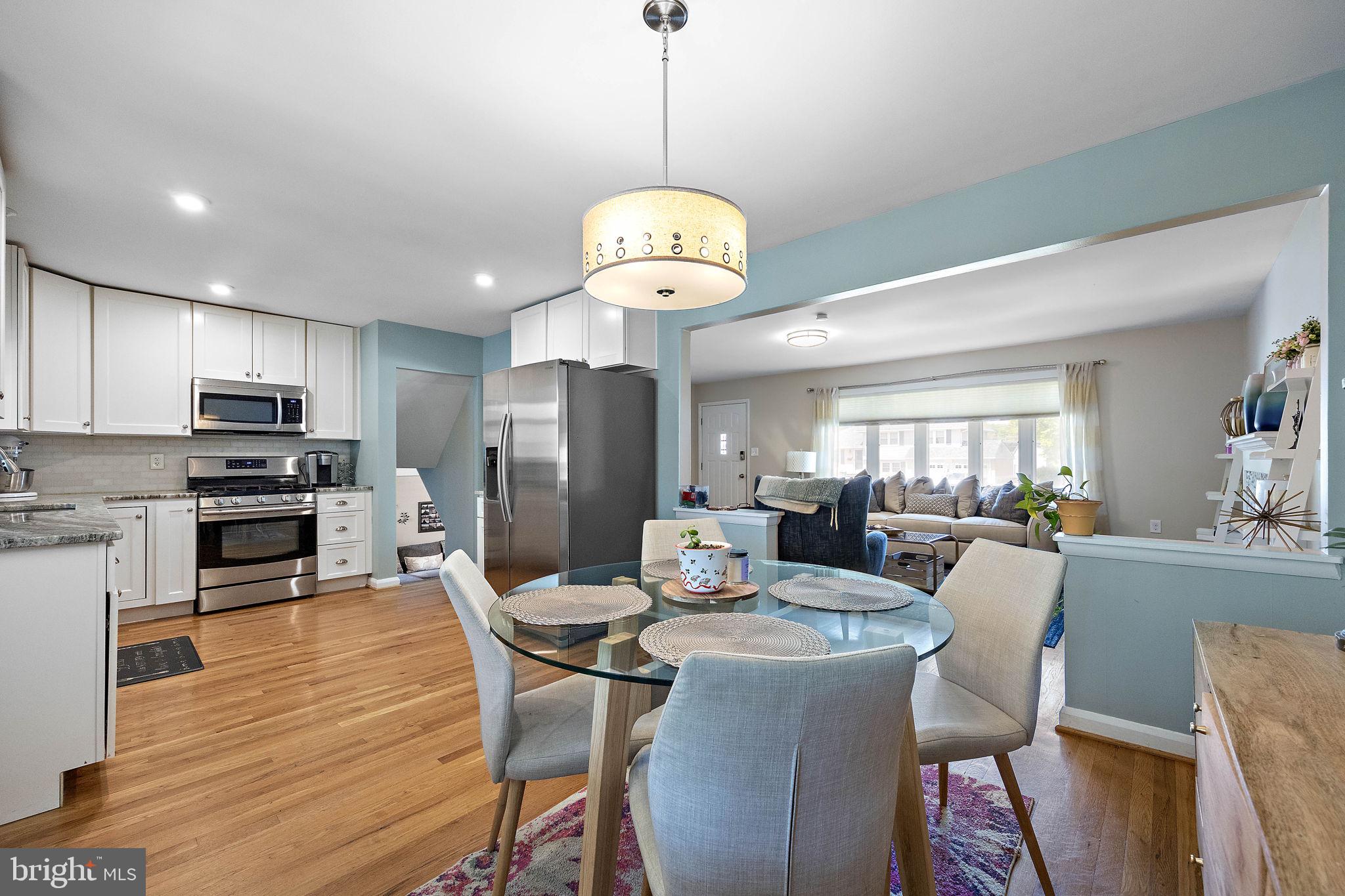 1010 Graylyn Road Wilmington, DE 19803 - Photo 8 of 32 a dining room filled chandelier and wooden floor