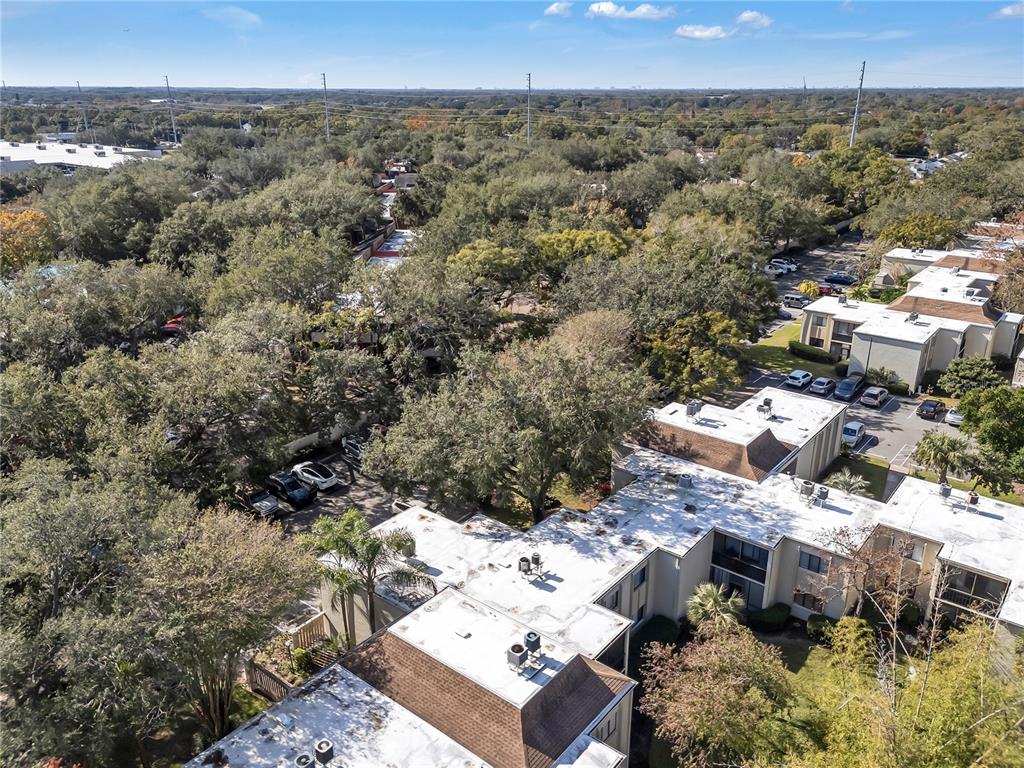 3286 South Semoran Boulevard, Unit 25 Orlando, FL 32822 - Photo 18 of 30 an aerial view of a house with a yard