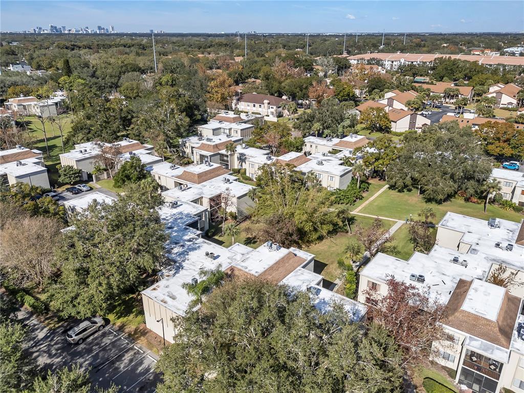 3286 South Semoran Boulevard, Unit 25 Orlando, FL 32822 - Photo 20 of 30 an aerial view of residential building with parking space