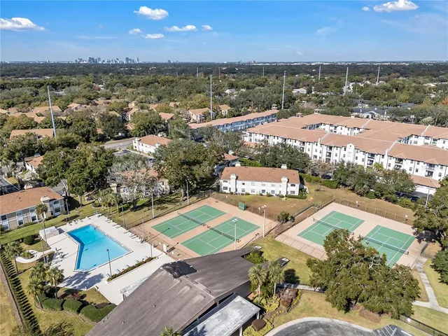 an aerial view of residential houses with outdoor space