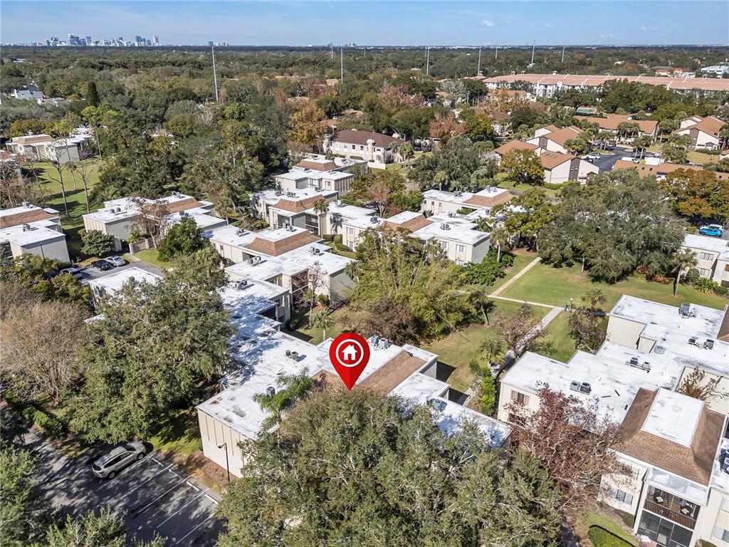 3286 South Semoran Boulevard, Unit 25 Orlando, FL 32822 - Photo 29 of 30 an aerial view of residential house with parking space