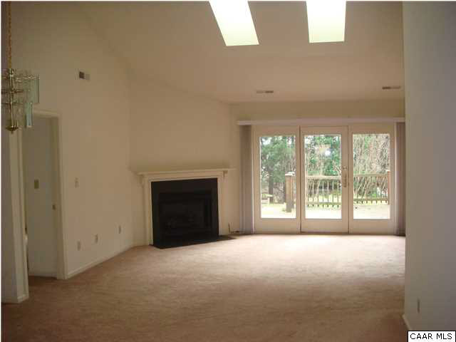 4825 Mechums River Road Charlottesville, VA 22901 - Photo 3 of 15 a view of an empty room with a fireplace