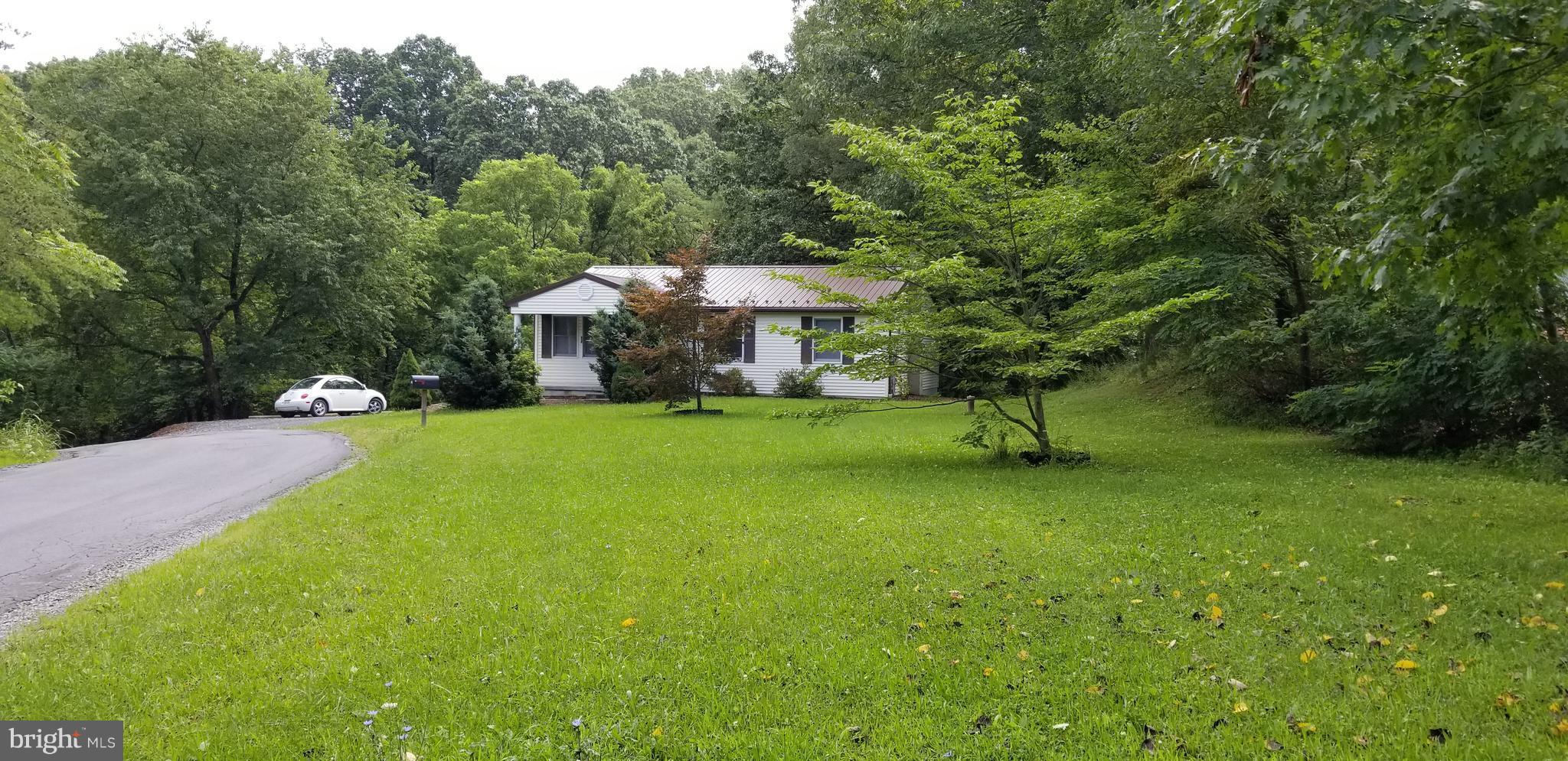 416 Paradise Valley Road Falling Waters, WV 25419 - Photo 5 of 30 Shaded front yard; view of home