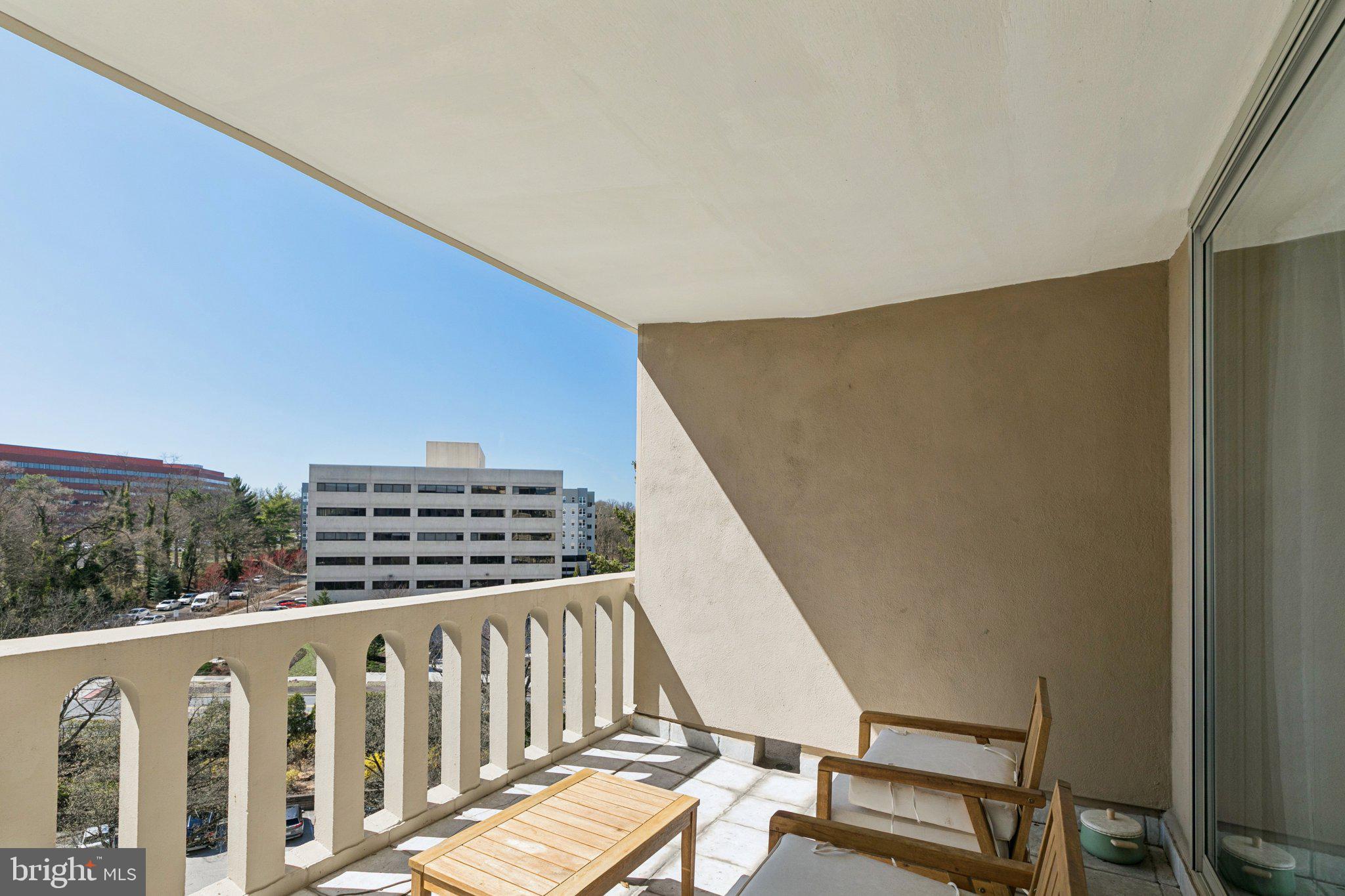 191 Presidential Boulevard, Unit R724 Bala Cynwyd, PA 19004 - Photo 14 of 19 a view of a balcony with wooden floor and fence