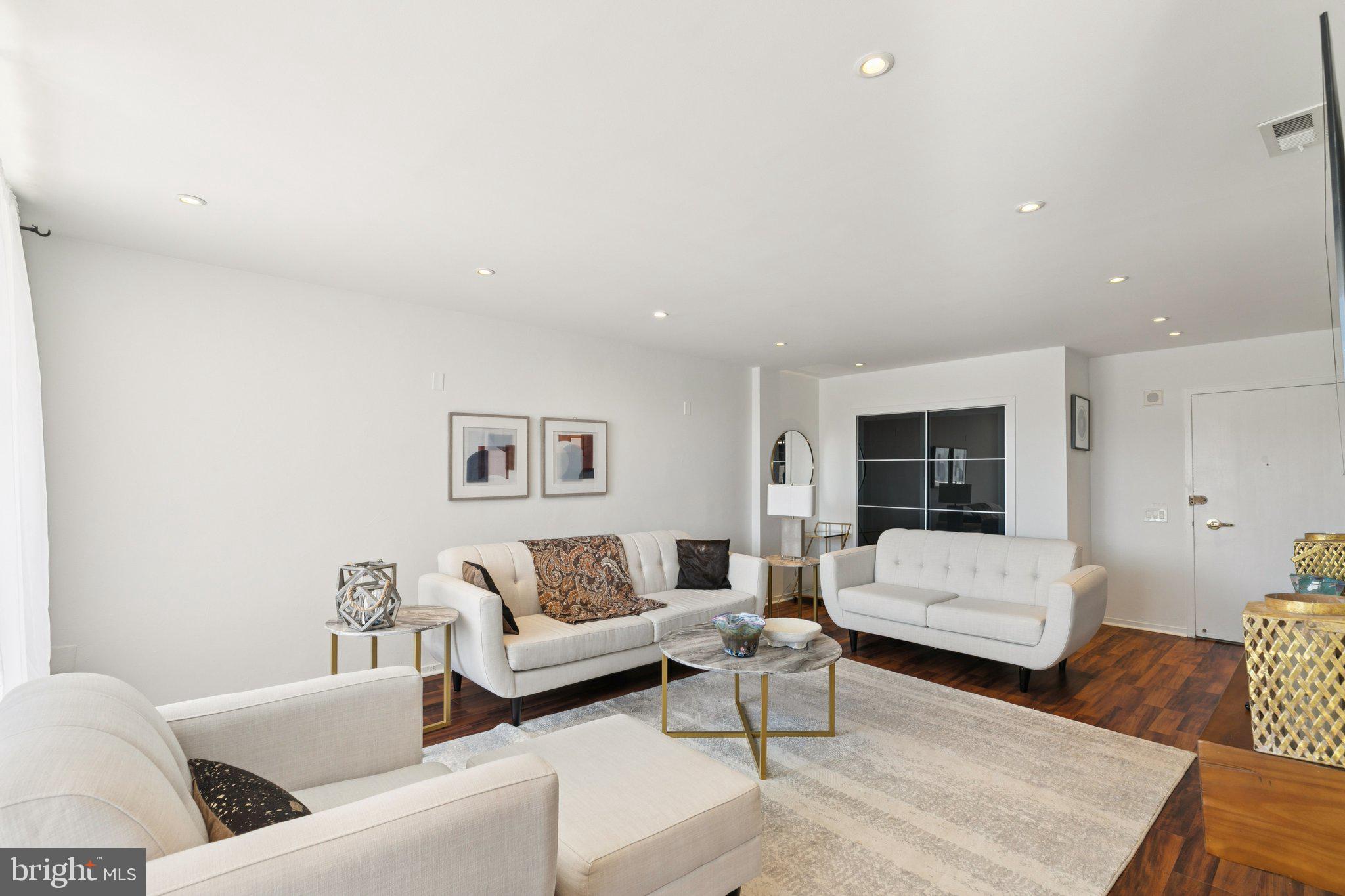 191 Presidential Boulevard, Unit R724 Bala Cynwyd, PA 19004 - Photo 3 of 19 a living room with furniture and a couch