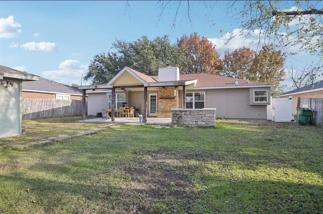 a front view of a house with a garden and porch