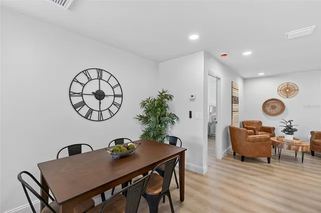 a large kitchen with stainless steel appliances lots of counter top space