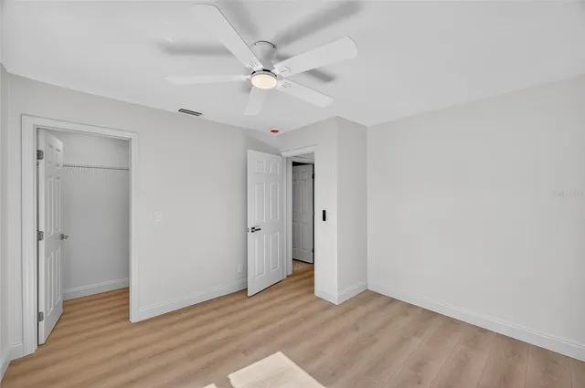 a bathroom with a shower and toilet