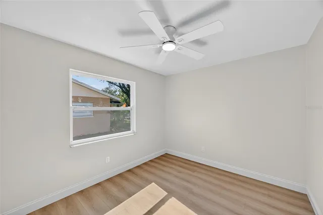 a view of an empty room with a window