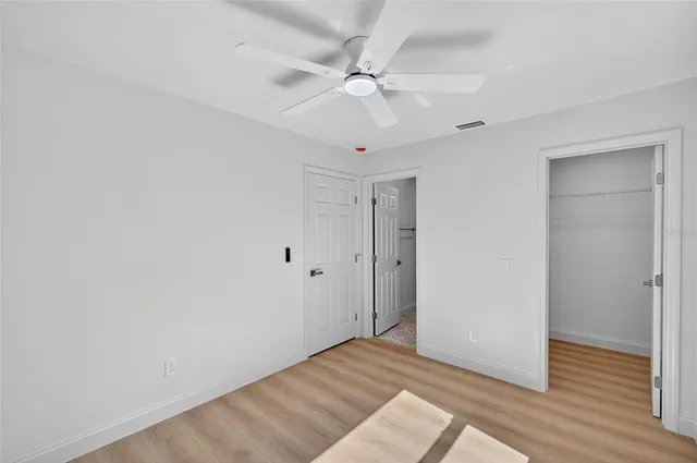 a view of an empty room with a large window