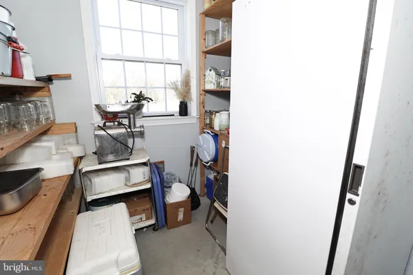a view of a livingroom with furniture and window