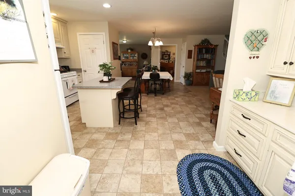 a view of a lake with a yard and trees