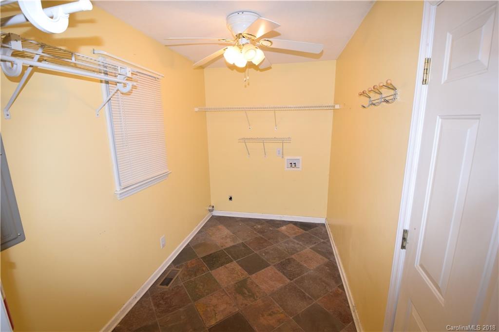 171 Hunters Trace Rutherfordton, NC 28139 - Photo 11 of 24 a view of a bathroom with a shower and a mirror