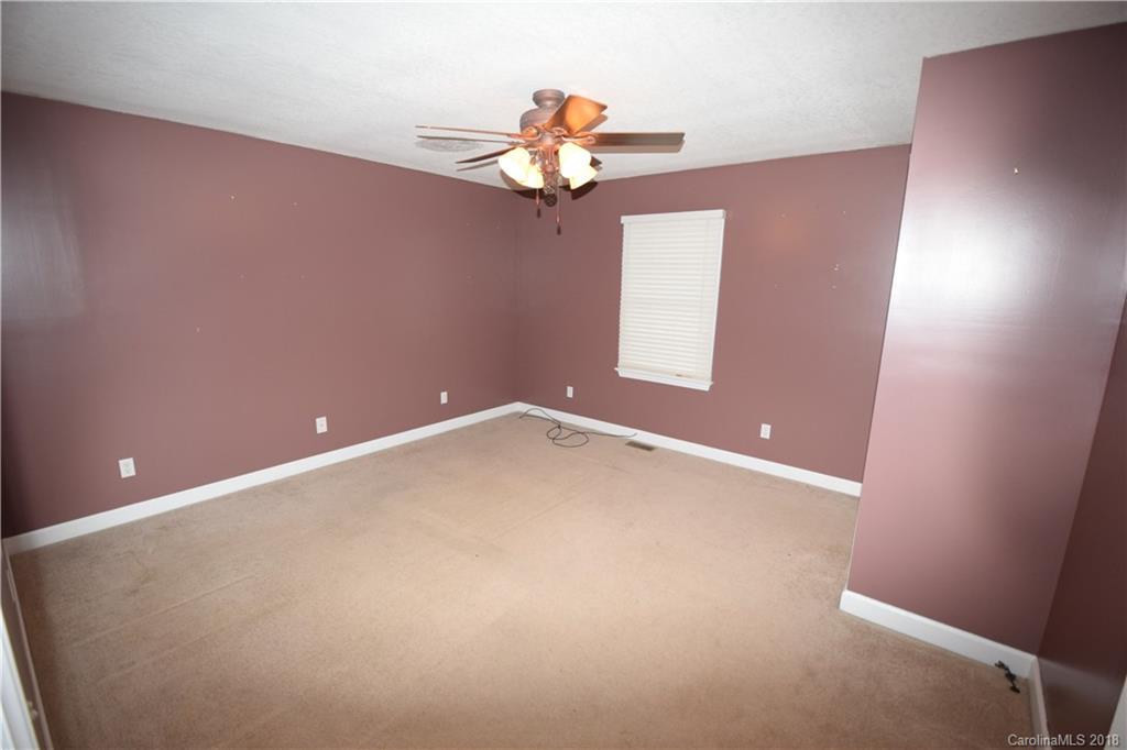 171 Hunters Trace Rutherfordton, NC 28139 - Photo 17 of 24 a view of a chandelier fan and fire place