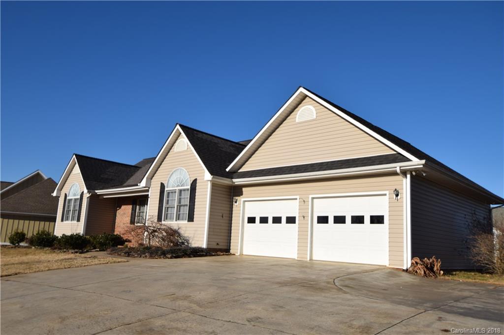 171 Hunters Trace Rutherfordton, NC 28139 - Photo 22 of 24 a front view of a house with a yard