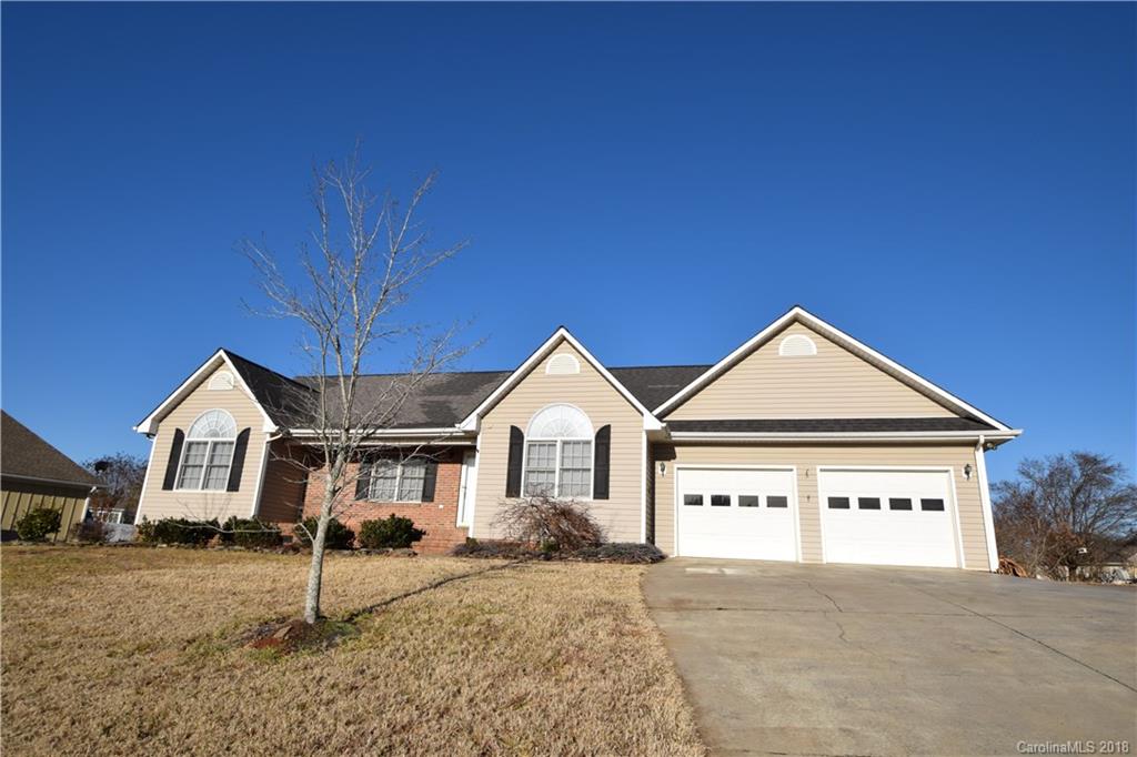 171 Hunters Trace Rutherfordton, NC 28139 - Photo 24 of 24 a front view of a house with a yard and garage