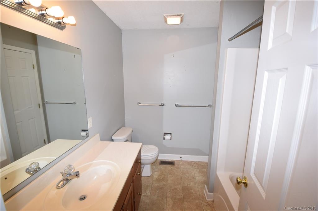 171 Hunters Trace Rutherfordton, NC 28139 - Photo 5 of 24 a bathroom with a tub and shower