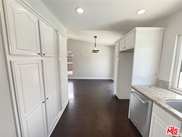 a view of hallway with wooden floor