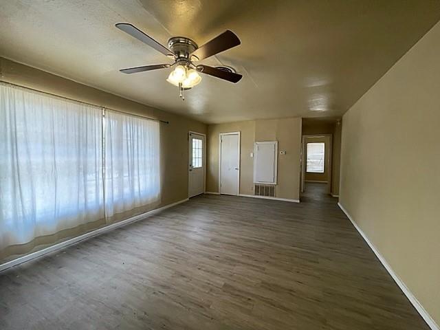 10 Pershing Drive, Unit A Denison, TX 75020 - Photo 4 of 15 a view of an empty room with window and wooden floor