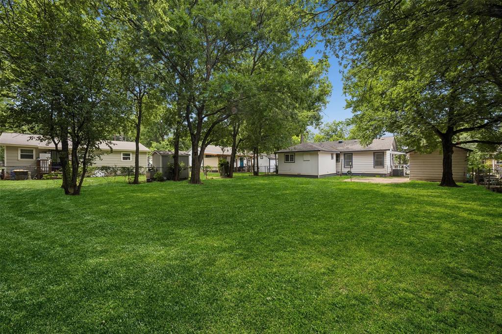 117 Moon Street Cleburne, TX 76033 - Photo 26 of 28 a front view of house with a garden