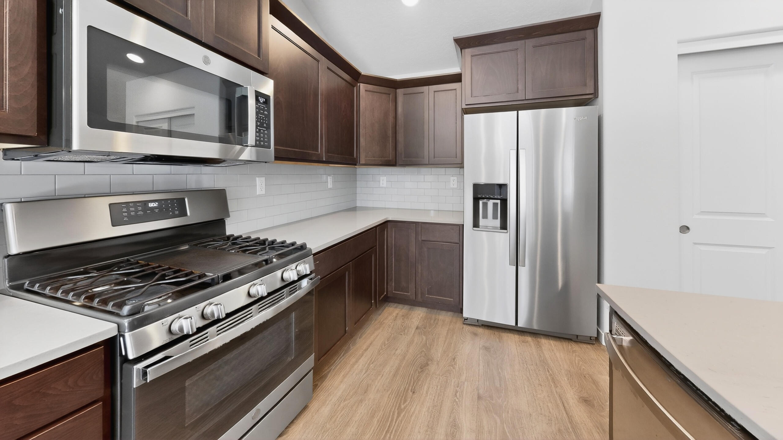 680 McKinney Ranch Road Sisters, OR 97759 - Photo 23 of 41 a kitchen with stainless steel appliances a refrigerator stove and microwave