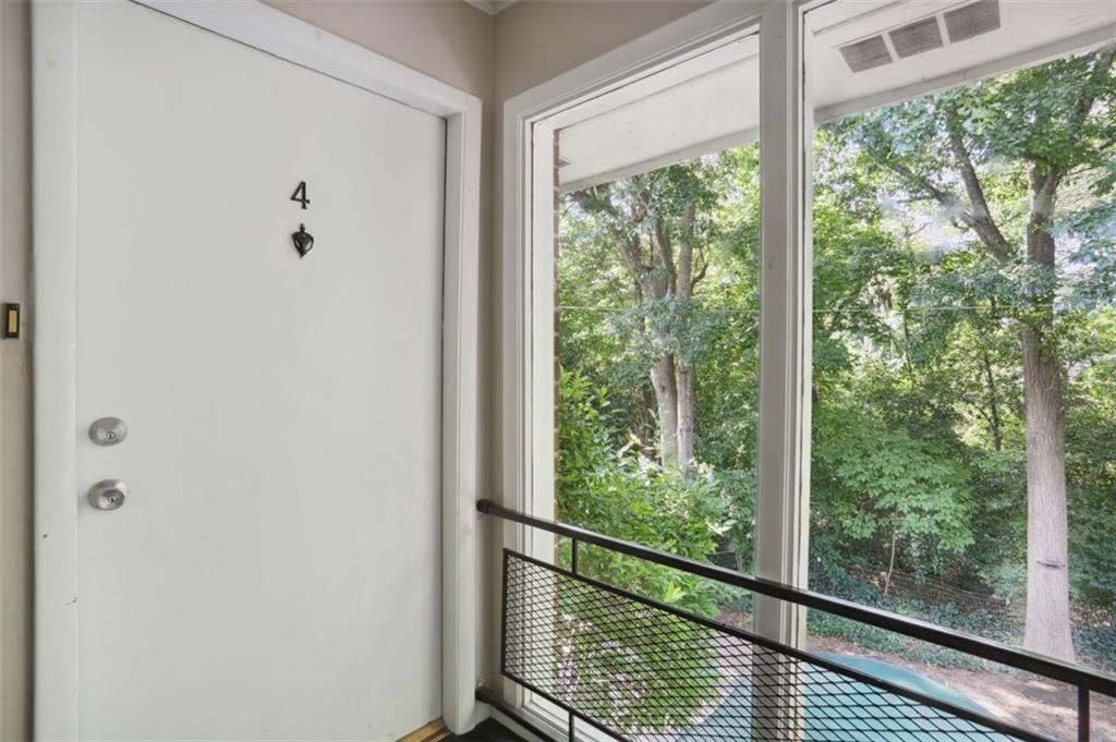 a view of a balcony with wooden floor