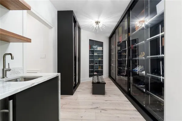 a very nice looking room with a large window and wooden floor