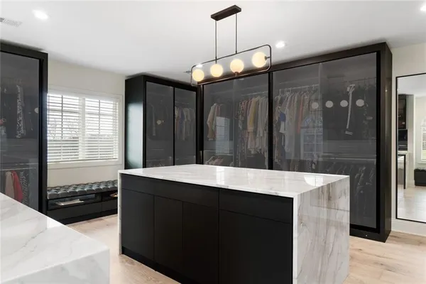 a kitchen with a counter space a sink and refrigerator