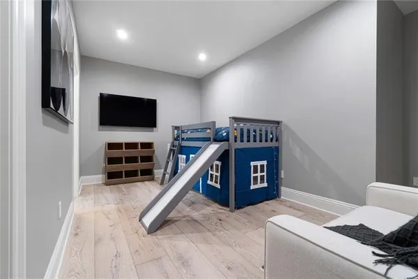 a view of a livingroom with furniture and staircase