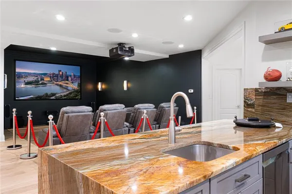 a kitchen with stainless steel appliances granite countertop a sink and a microwave