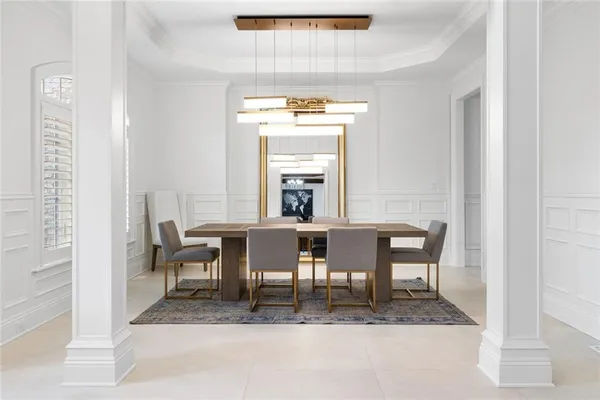a view of a dining room with furniture and a window