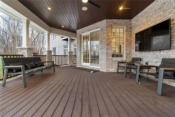 swimming pool view with a seating space and a garden view