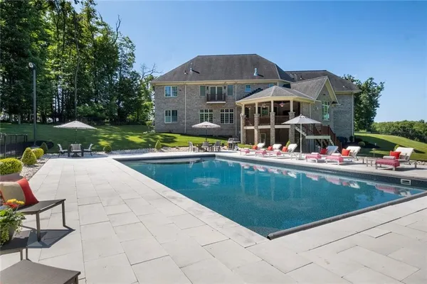 swimming pool with chairs