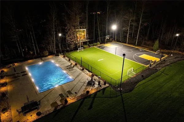 a view of building with river swimming pool and outdoor seating