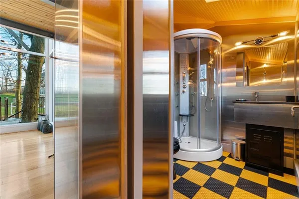 a bedroom with a bed and large window