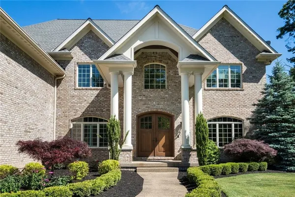 an aerial view of a house with outdoor space