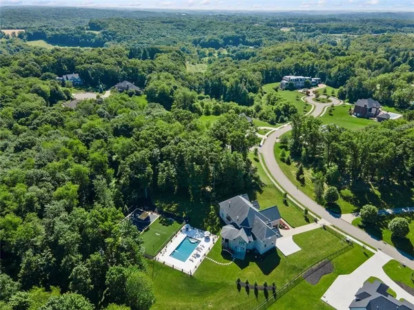 an aerial view of a house with a garden
