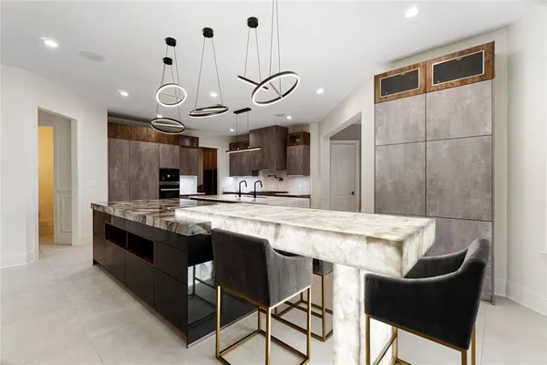 a kitchen with stainless steel appliances granite countertop a sink and cabinets