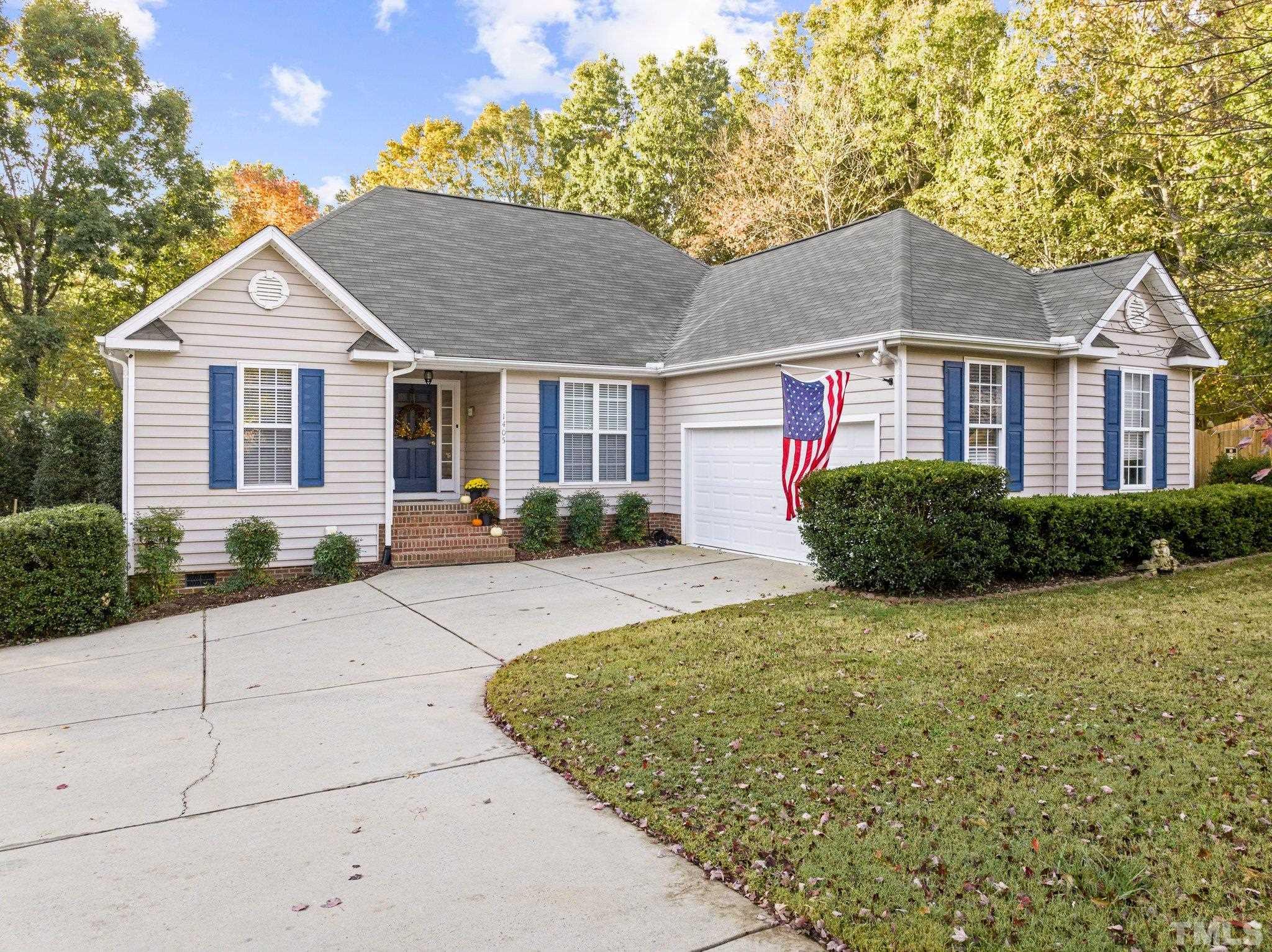 1405 Lynn Road Raleigh, NC 27612 - Photo 1 of 33 a front view of a house with a yard