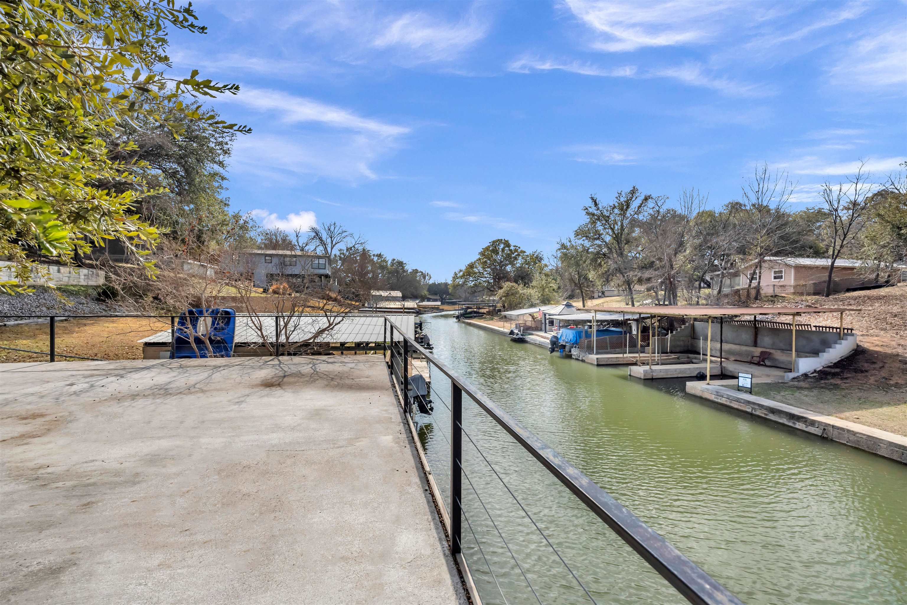 345 County Road 136C Kingsland, TX 78639 - Photo 1 of 30 a view of a lake with a house
